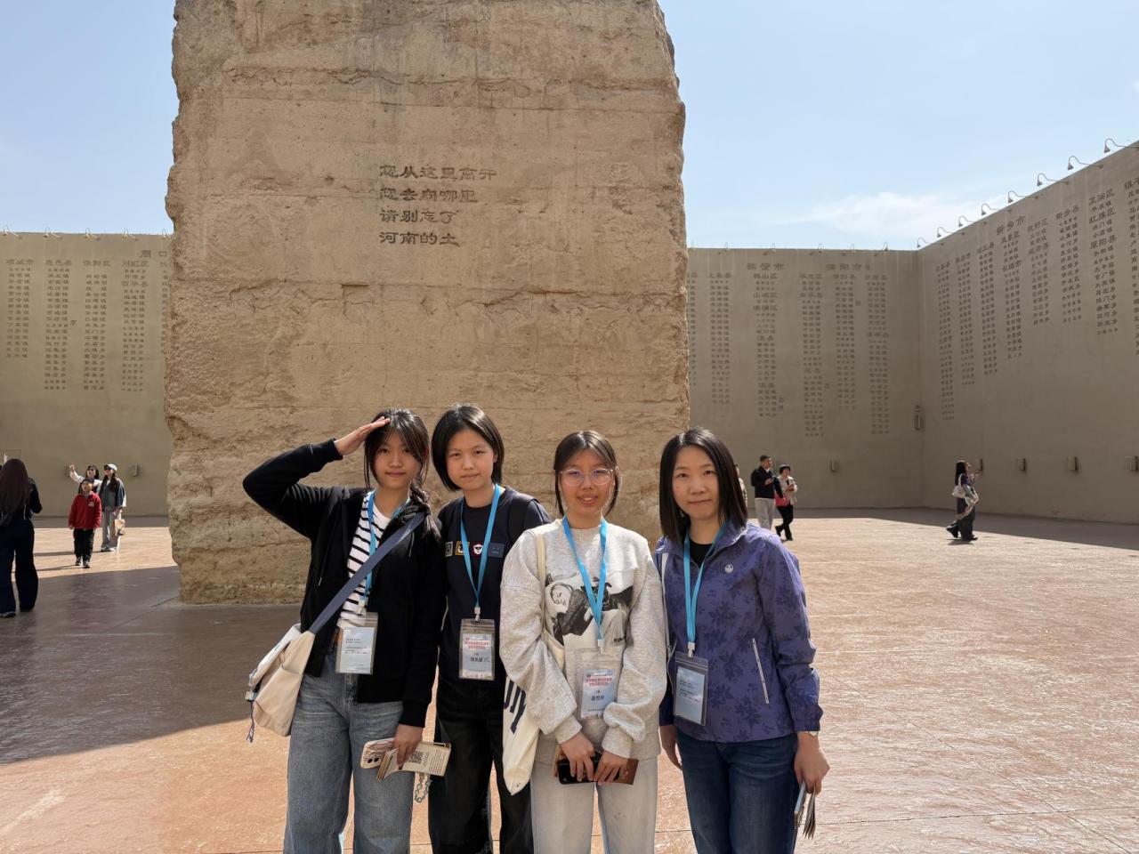 Group photo in front of the magnificent walls of “Only Henan” Drama Fantasy City.