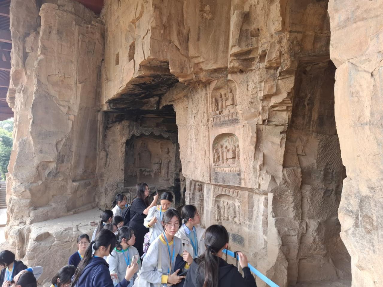 Group photo at Gongyi Grottoes, exploring historical art and culture.